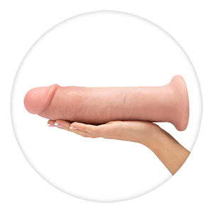 large dildo in a woman's hand